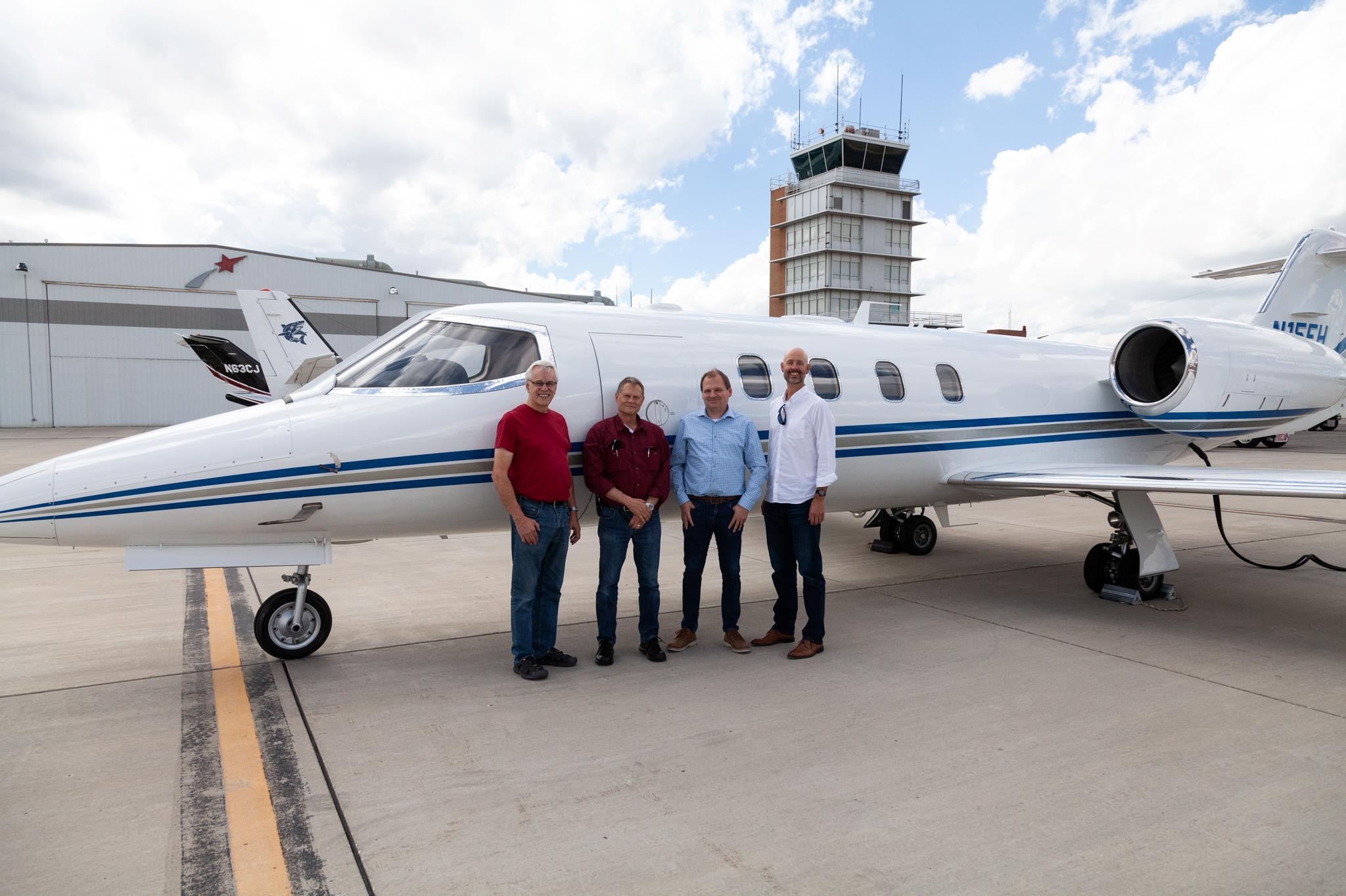 IO Aerospace team standing in front of the Learjet35